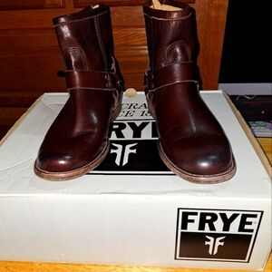 A pair of Frye Phillip Harness dark brown ankle boots in a women's size 6. EUC